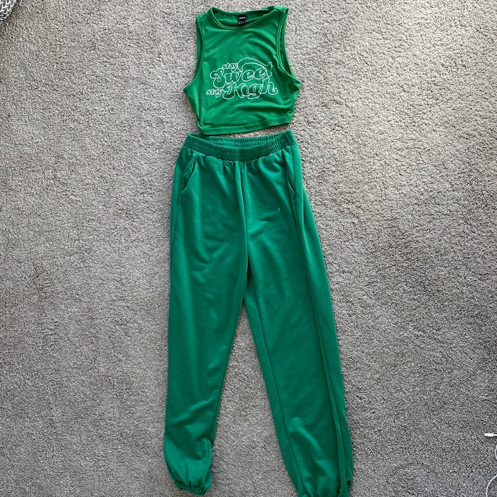 A comfy set, vibrant green, has pockets